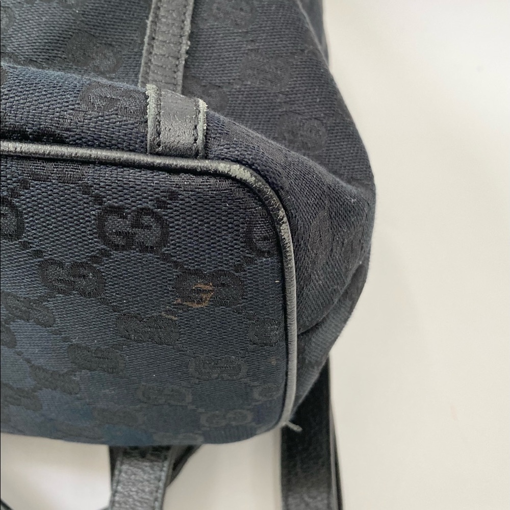 Gucci Black GG Canvas Drawstring Backpack with Gold Accent - Picture 12 of 14
